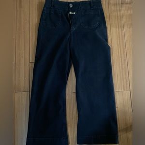 Black wide leg Pilcro pants.